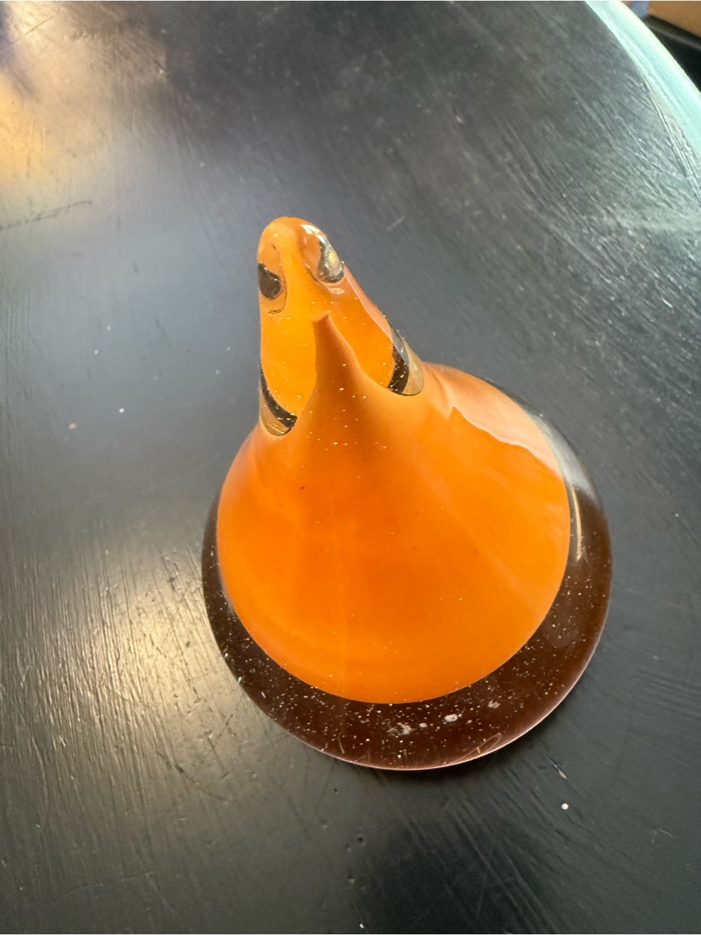 Orange art glass in a shape of a Hersey kiss